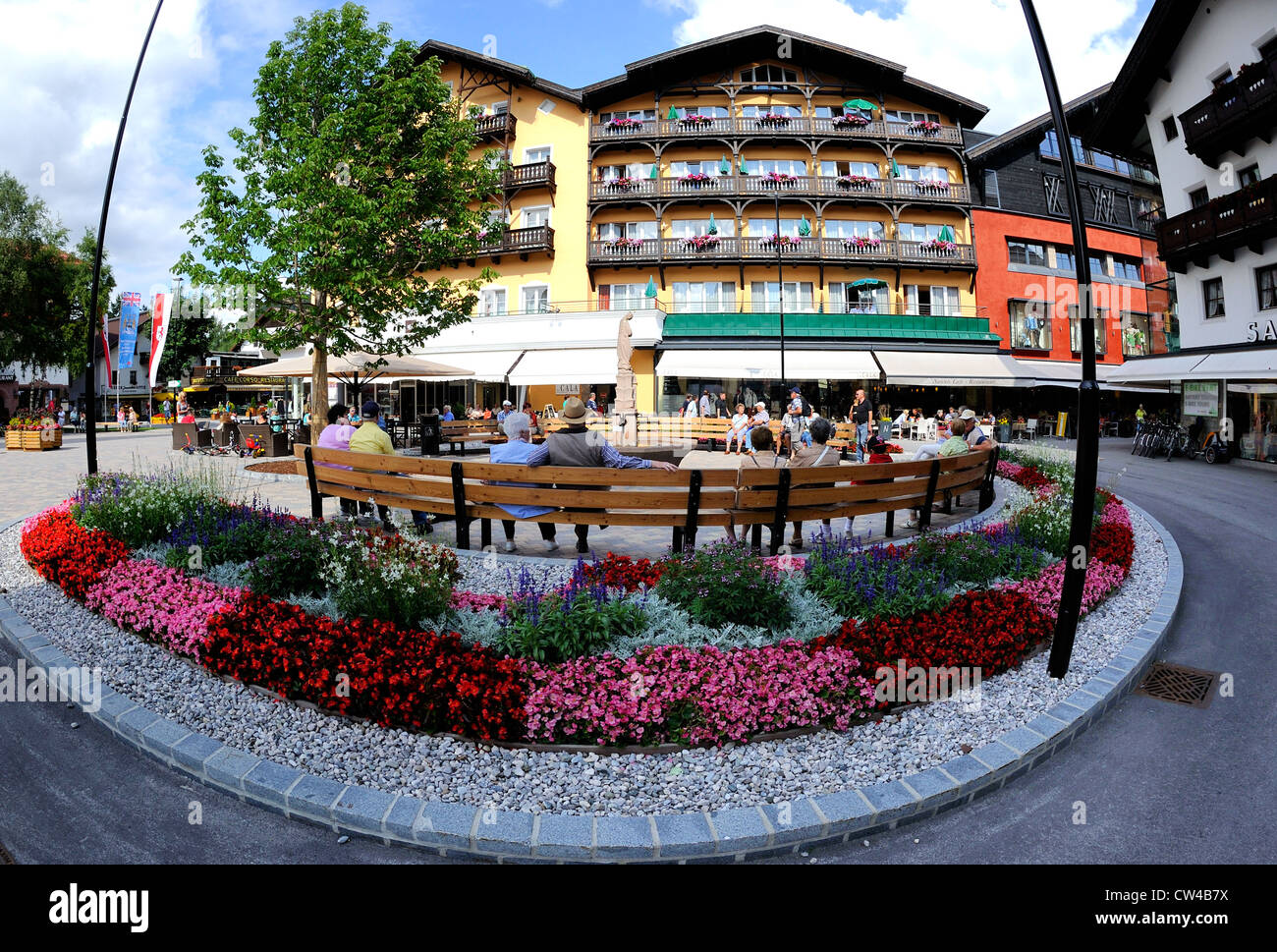 Main public square in Seefeld, Austria, with bedded flowers and seating for people to relax. Stock Photo