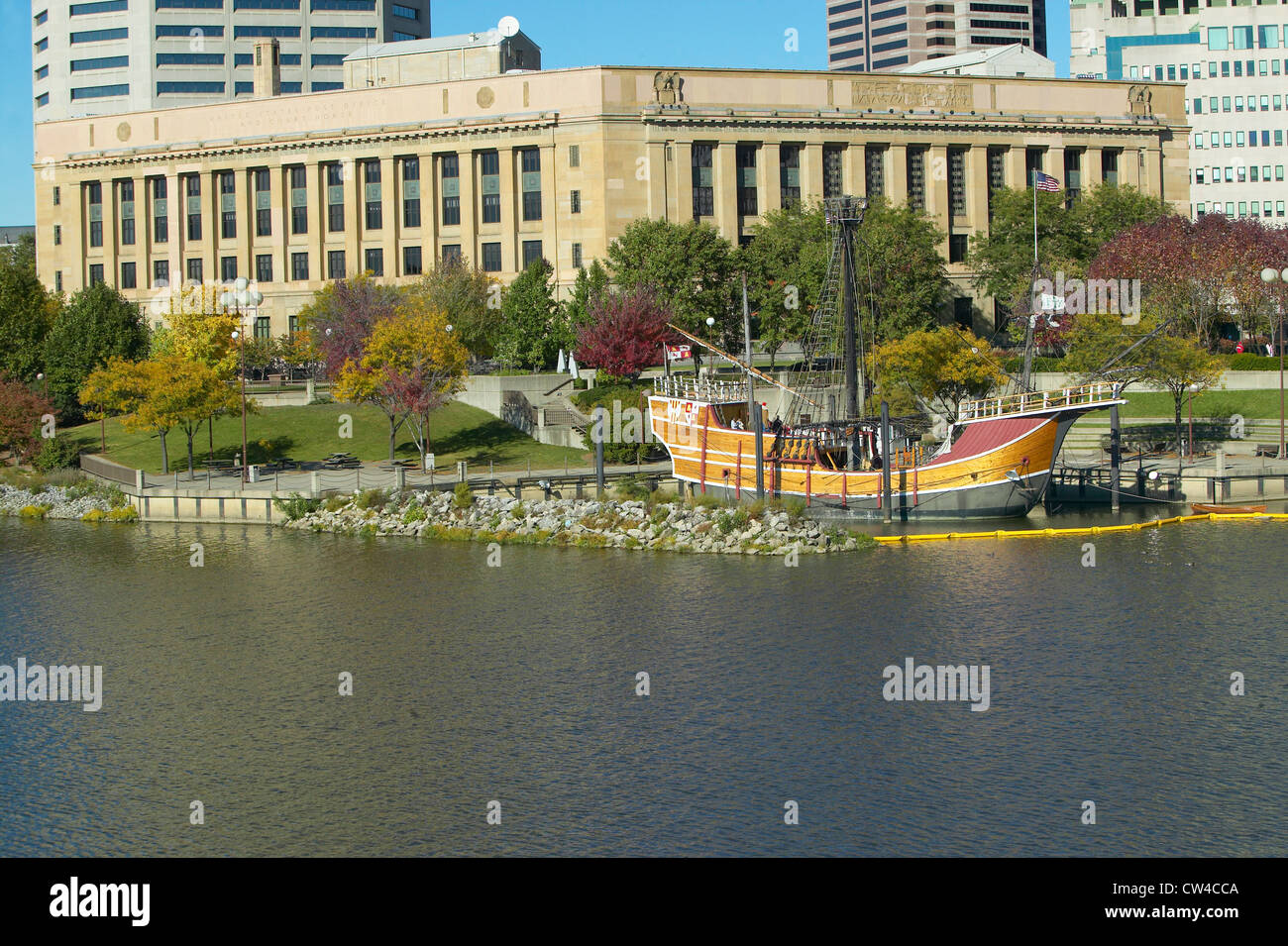 Replica of Columbus' ship the Santa Maria on Scioto River, Columbus Ohio skyline in autumn Stock Photo