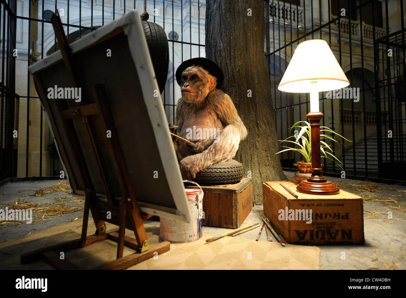 The 'Banksy Versus Bristol Museum' exhibition 2009 - an animatronic caged monkey as a painter Stock Photo