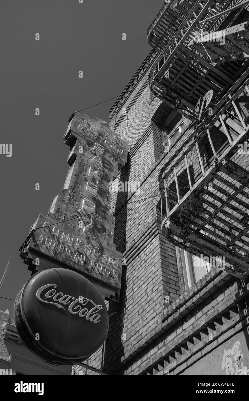 Bakery Shop Front with Vintage Coca Cola Sign and Rusty Fire Escape on Grant Avenue in Chinatown, San Francisco Stock Photo