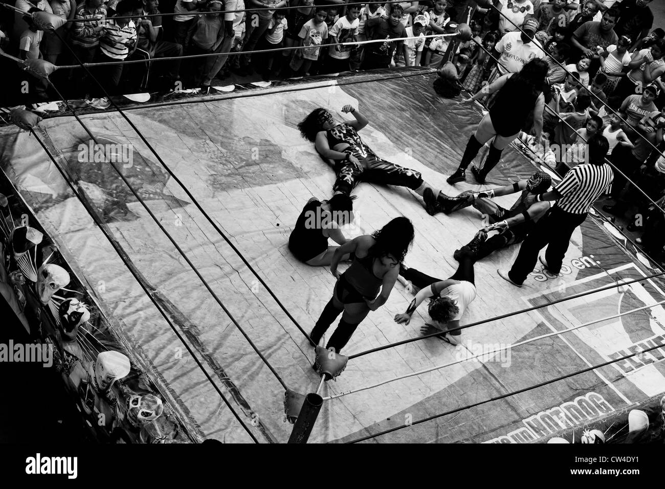 Female Lucha libre wrestlers fight during a mixed-sex performance at a local arena in Mexico City, Mexico Stock Photo