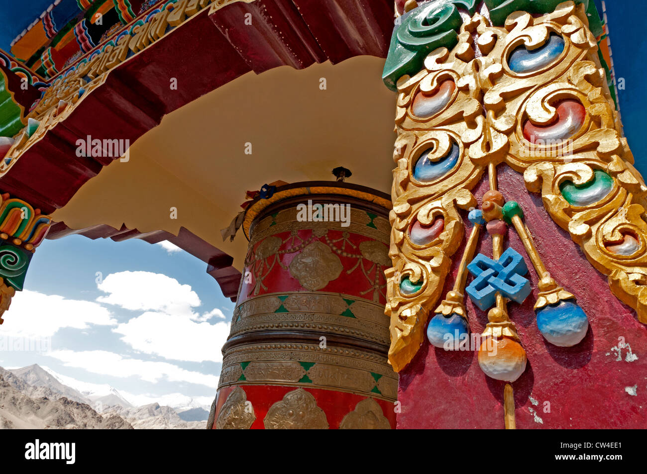 Prayer wheel in an open-sided street-side structure at an intersection in downtown Leh, Ladakh, India Stock Photo