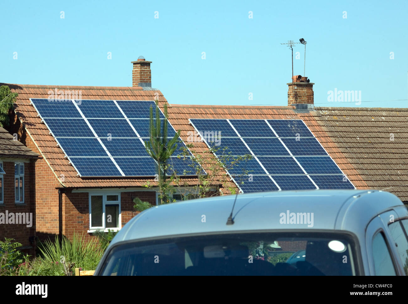 solar panels on roofs of private housing england Stock Photo - Alamy