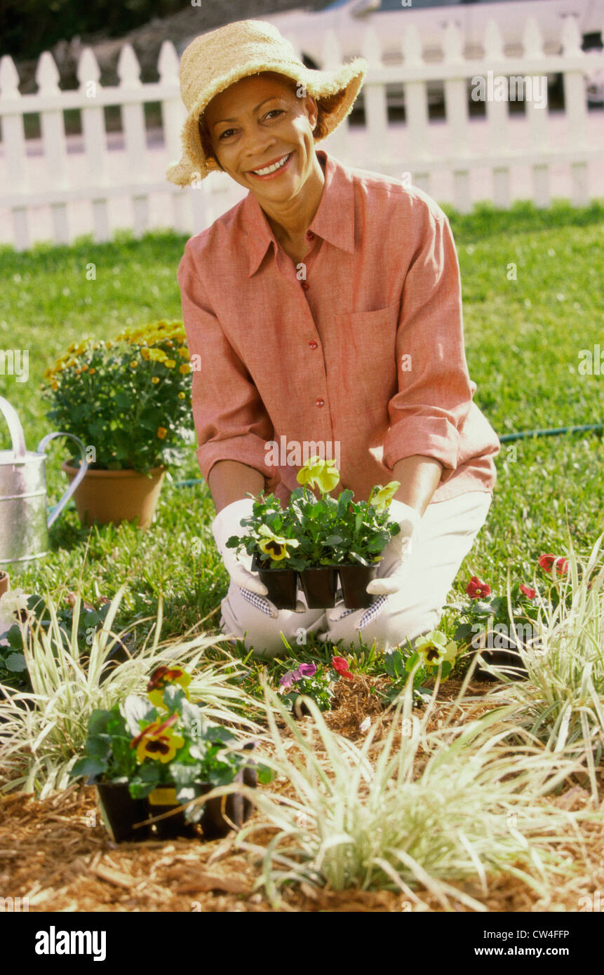 Portrait of a senior woman gardening Stock Photo - Alamy