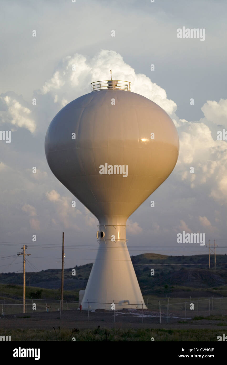 Water tower sunset with clouds behind it in Lower Brule Lyman County
