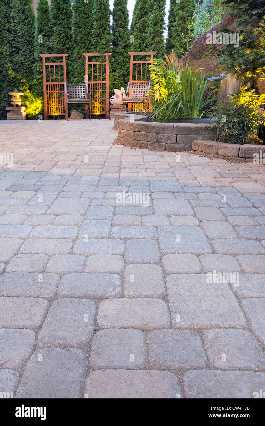 Garden Paver Patio with Trellis Japanese Stone Lantern Pagoda Waterfall Pond and Landscaping Lights Stock Photo