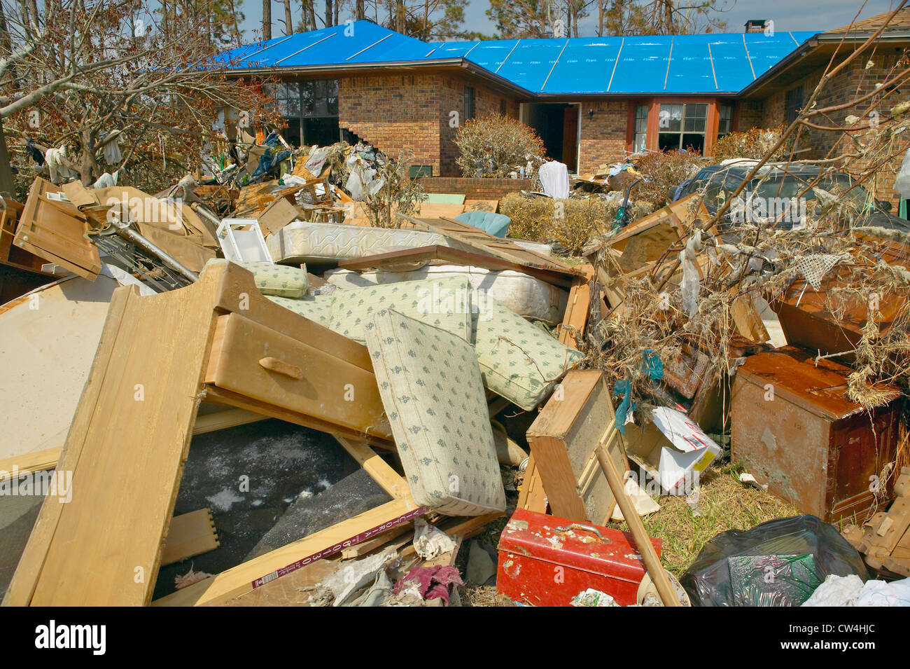 Debris in front of house heavily hit by Hurricane Ivan in Pensacola ...
