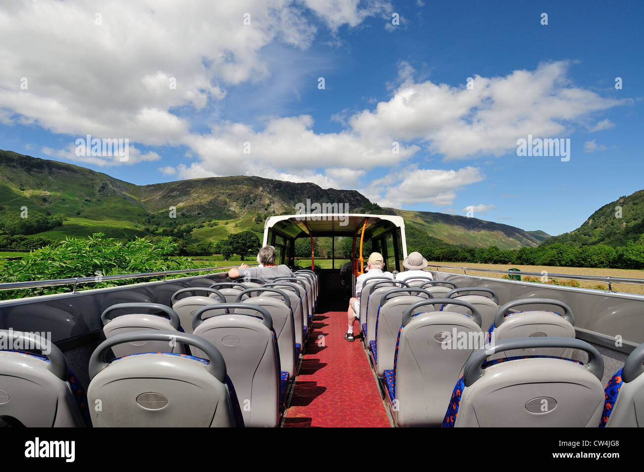 Open top bus travel in Borrowdale in summer in the English Lake District Stock Photo