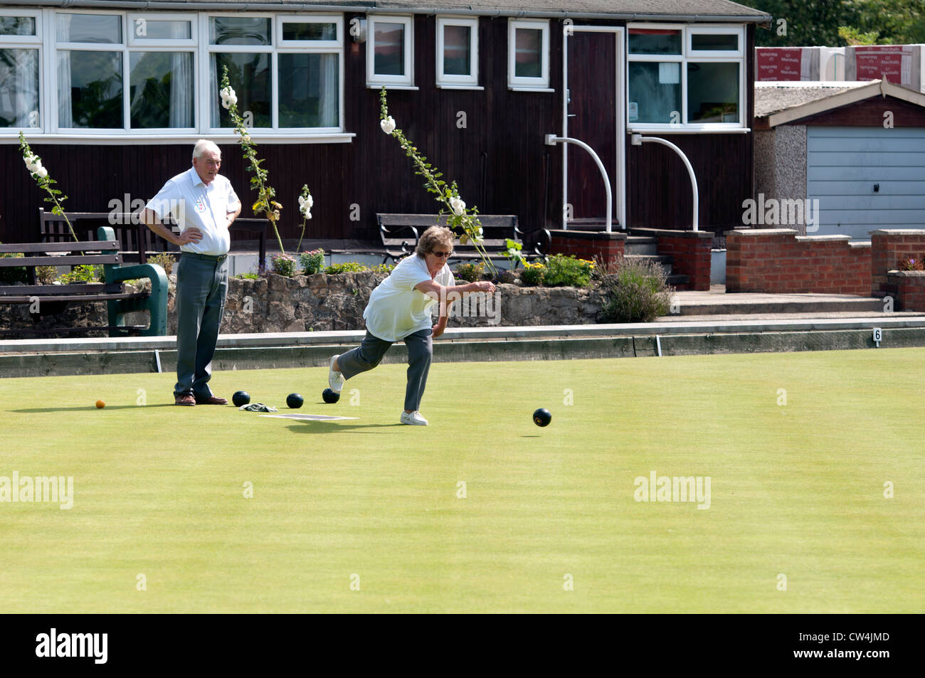 Couple playing bowls at Narborough Bowling Club, Leicestershire, UK Stock Photo