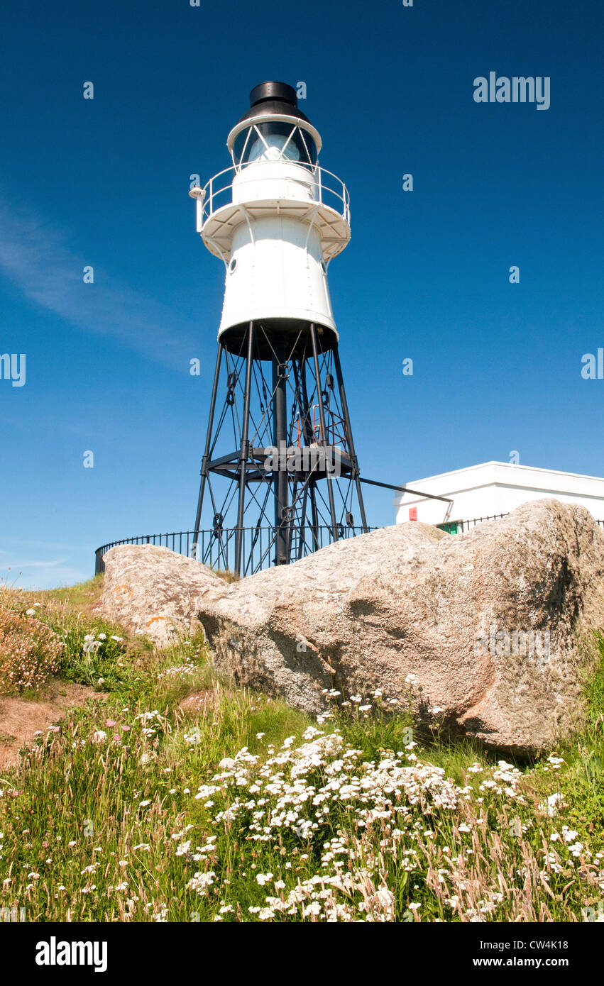 Lighthouse and Granite Rocks off Peninnis Headland St Marys Isles of Scilly, lighthouse built in 1911. Stock Photo
