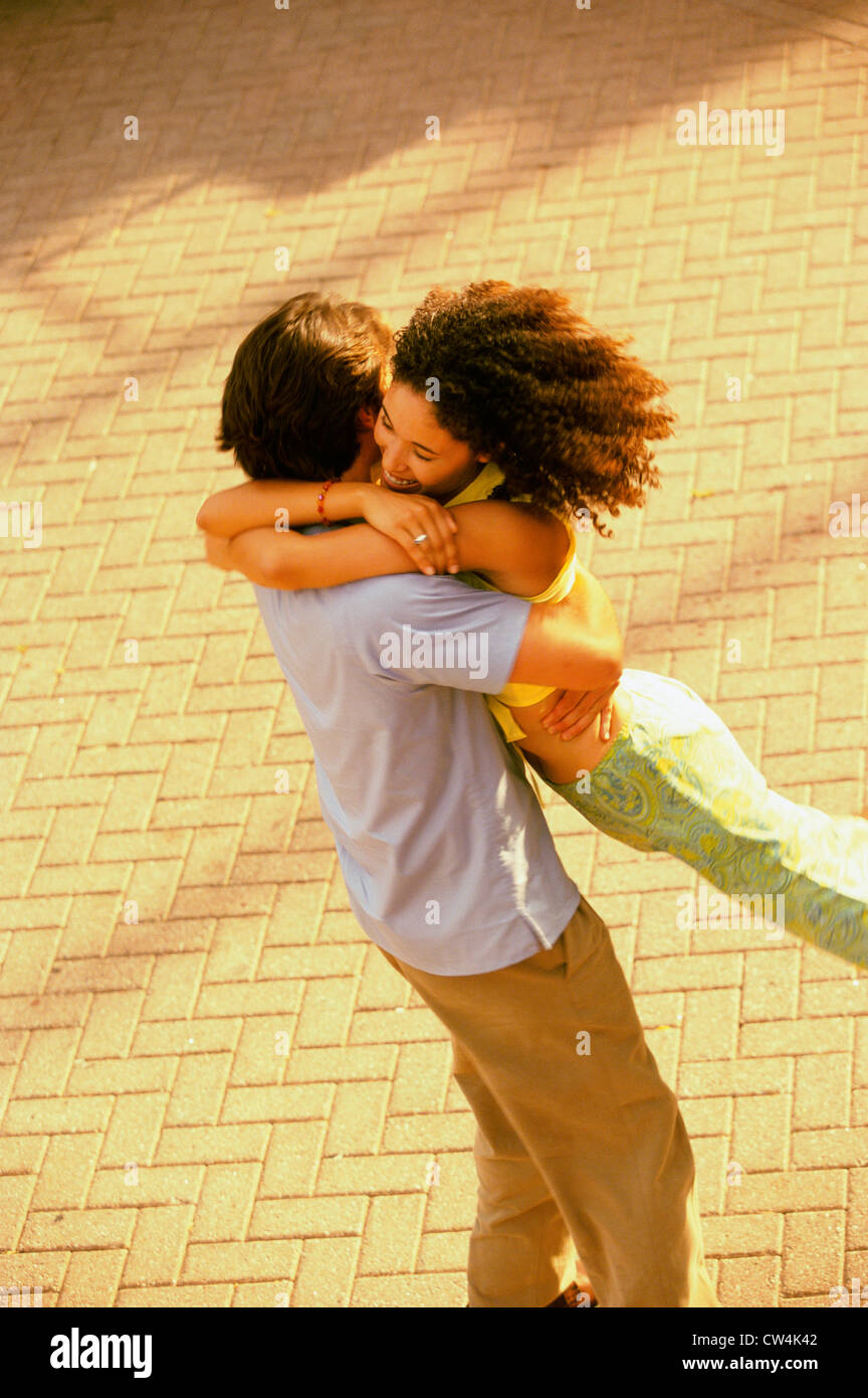 High angle view of a young man embracing a young woman Stock Photo - Alamy