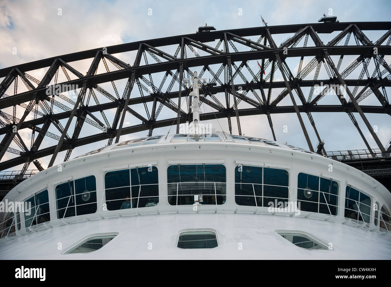 Luxury Cruise Liner Passing under the Sydney Harbour Bridge, Australia Stock Photo