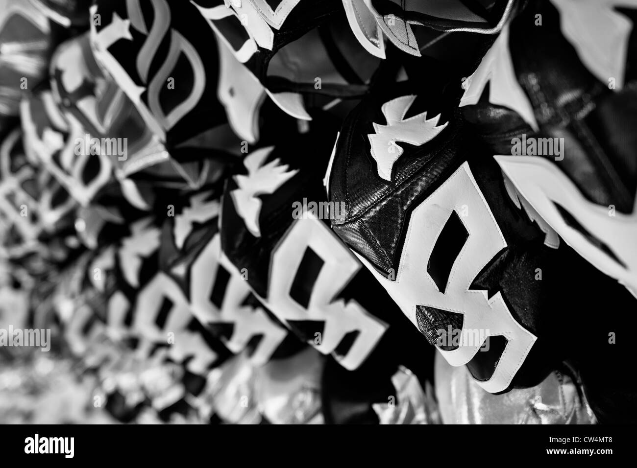 Lucha libre wrestling masks, inspired by those worn by professional wrestlers, displayed for sale in a shop in Mexico City. Stock Photo