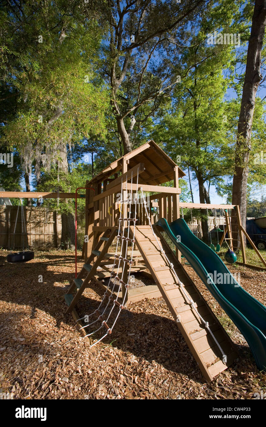 Slide with jungle gym at forest Stock Photo - Alamy