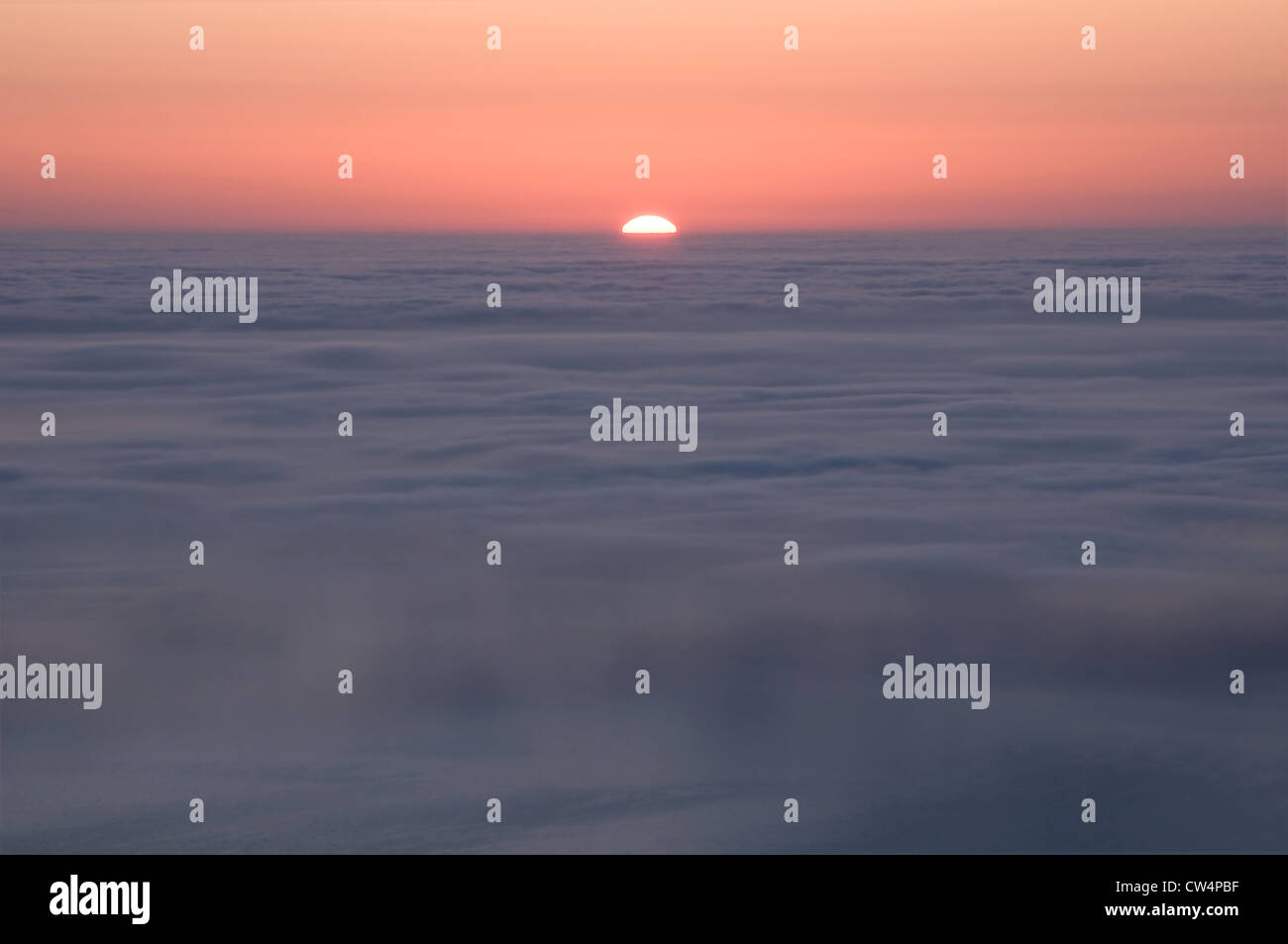 Sun rising over the mist covered sea in Crimea Stock Photo