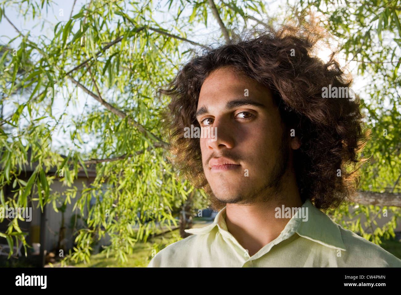 Curly brown hair man hi-res stock photography and images - Alamy