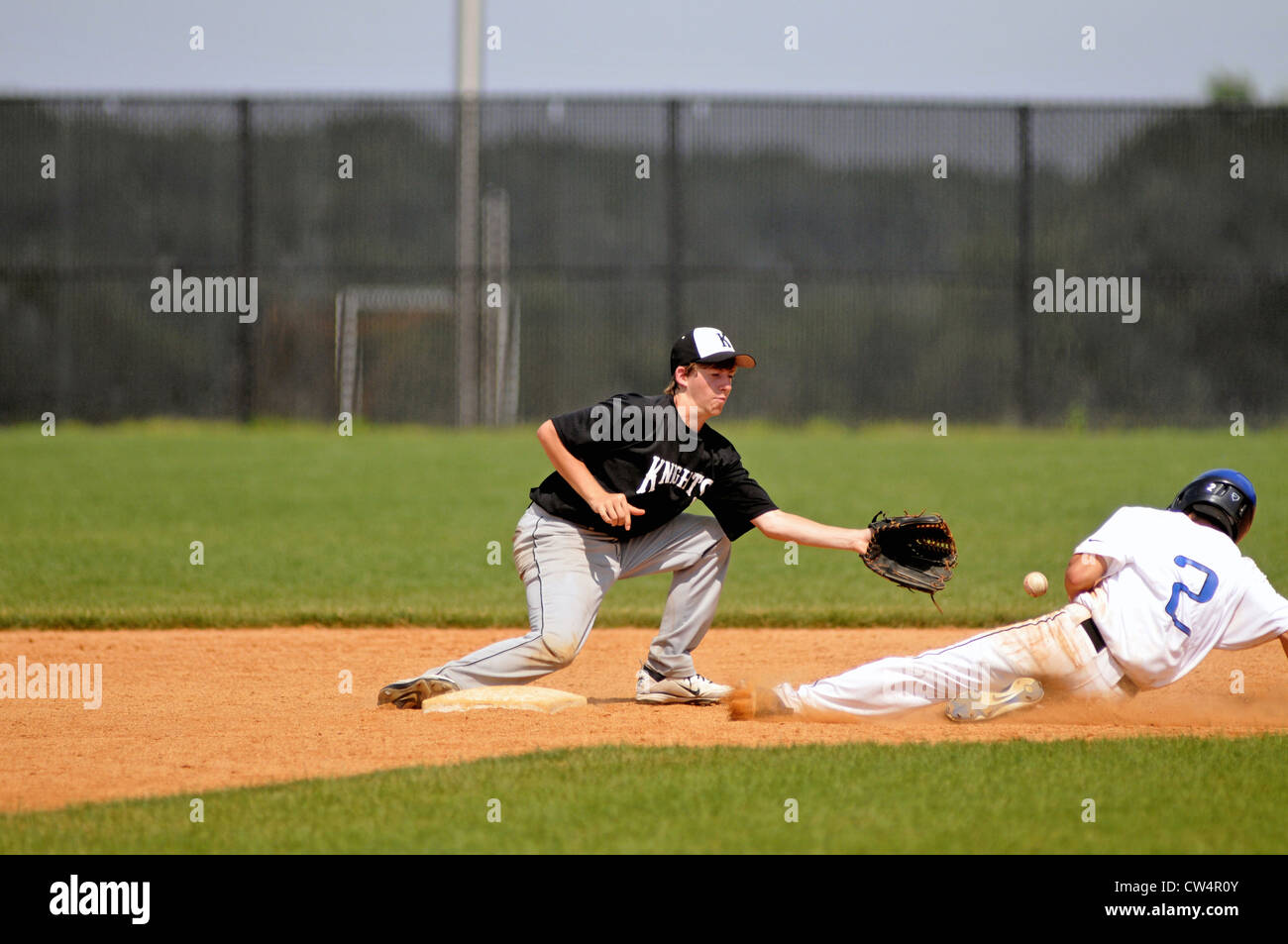 Baseball Infielder Fields Throw From His Catcher That Drifts Back