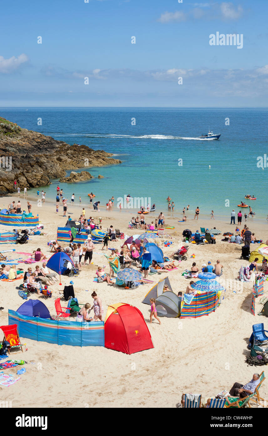 Holidaymakers on St. Ives Porthgwidden beach on a busy summer day in Cornwall UK. Stock Photo
