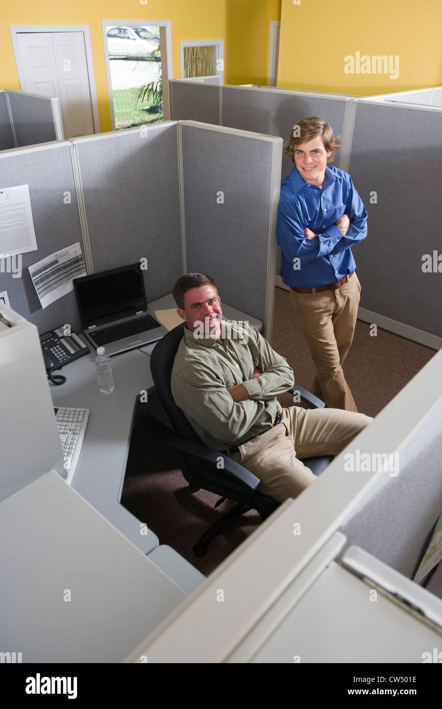 Portrait of businessmen smiling in an office Stock Photo - Alamy