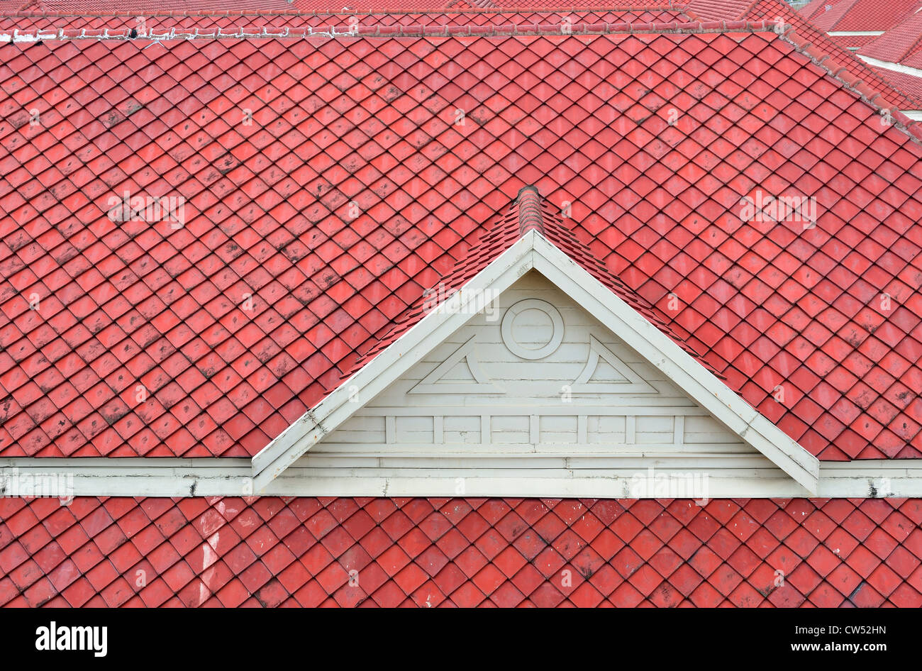 The white gable and red baked clay roof. Stock Photo