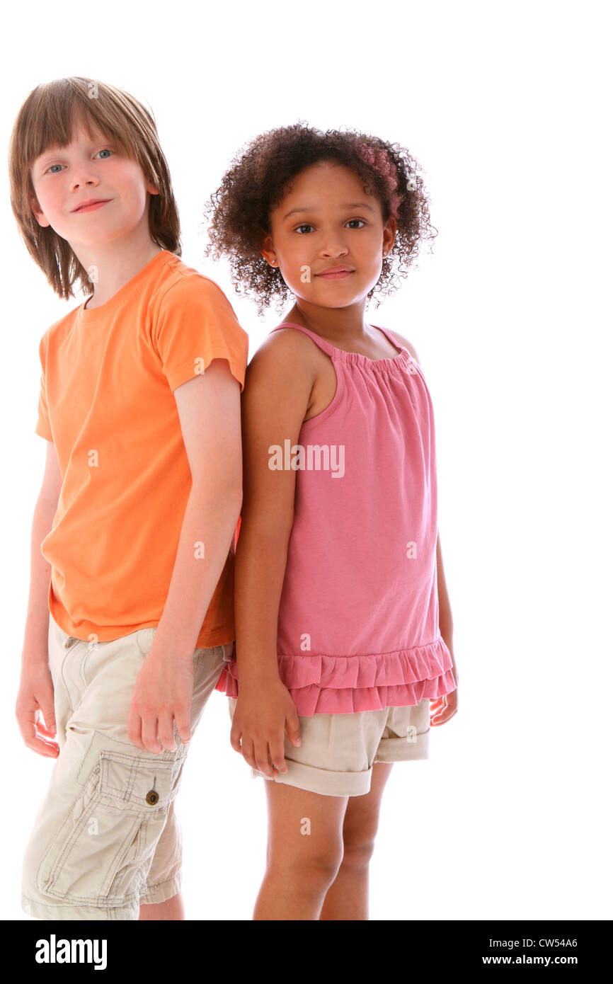 Boy and a girl standing back to back hi-res stock photography and ...
