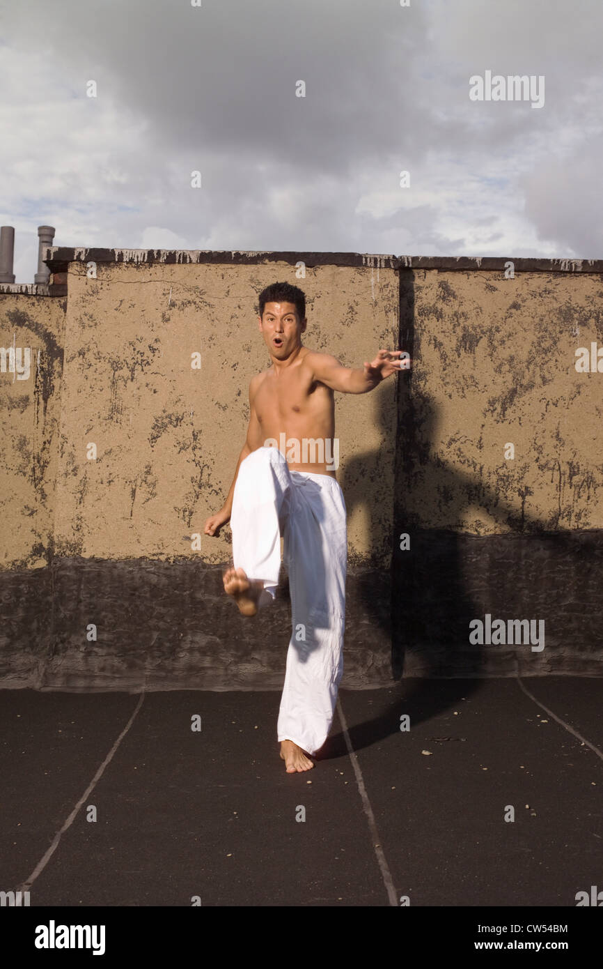 Young man practicing martial arts, New York City, New York State, USA