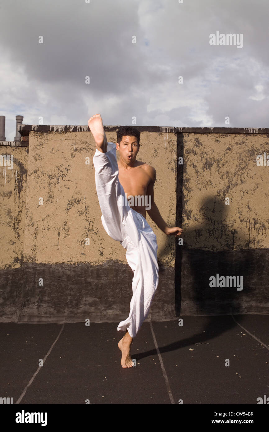 Young man practicing martial arts, New York City, New York State, USA
