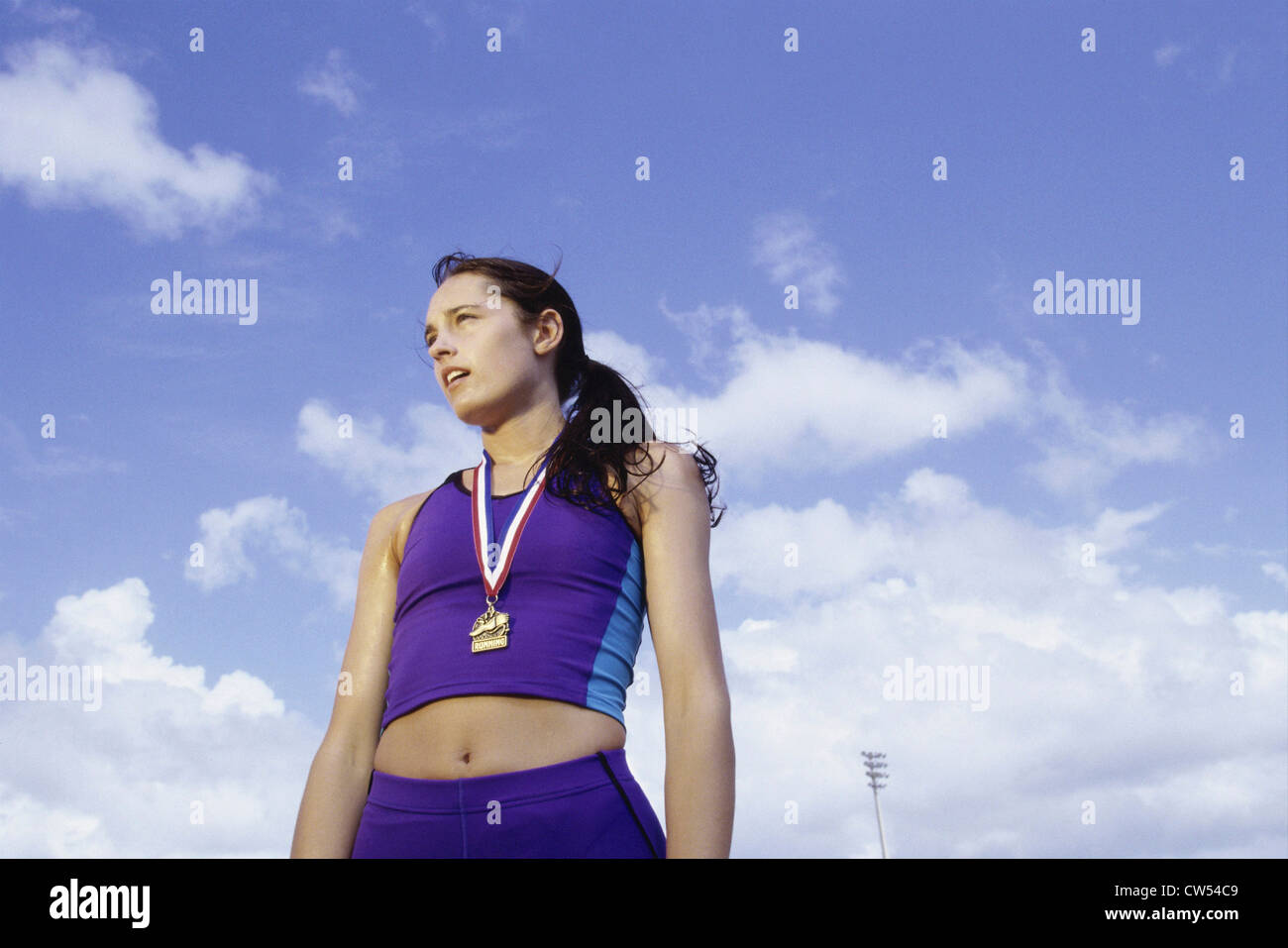 Low angle view of a young woman with a medal around her neck Stock Photo