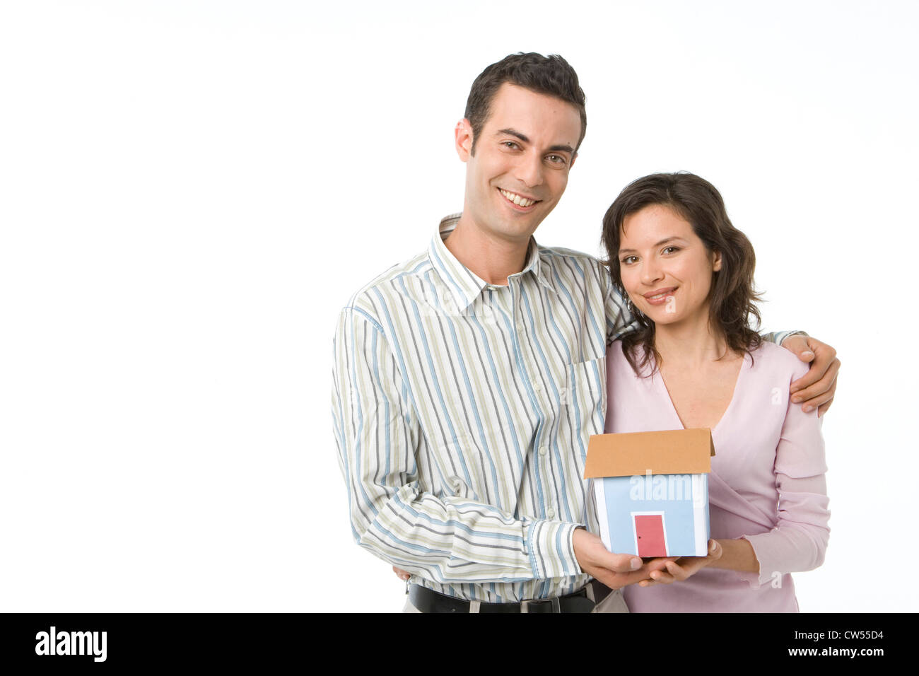 Young couple holding a model of a home Stock Photo - Alamy