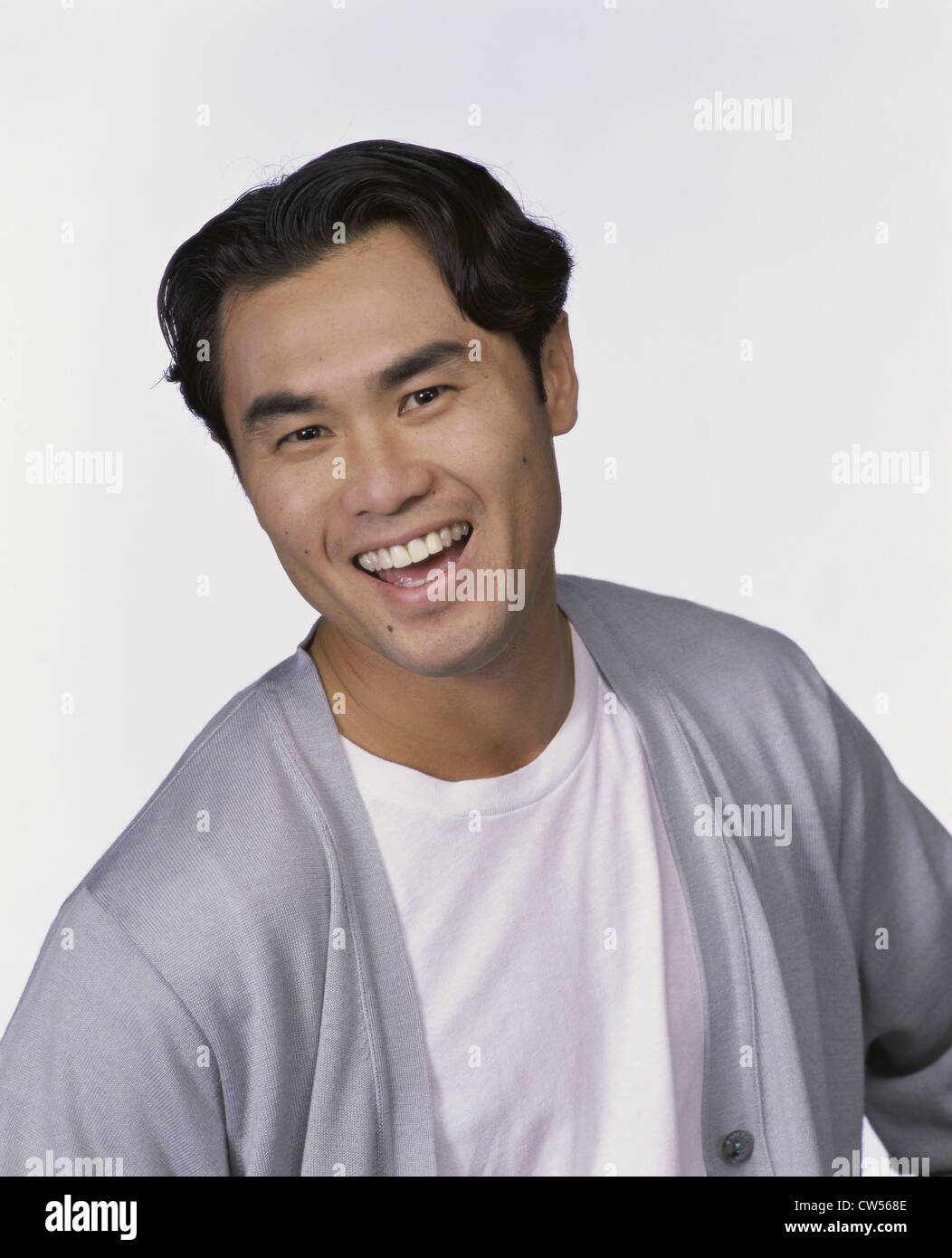 Portrait of a young man smiling Stock Photo - Alamy