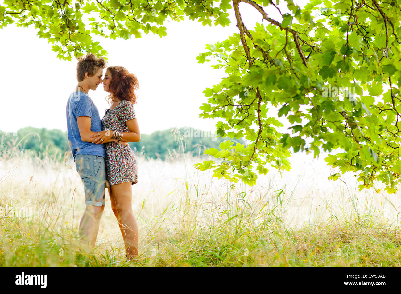 Romatic couple embracing outside Stock Photo - Alamy