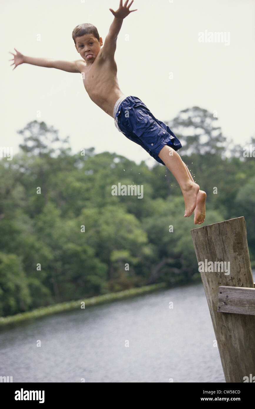 Portrait of a boy jumping into water Stock Photo Alamy
