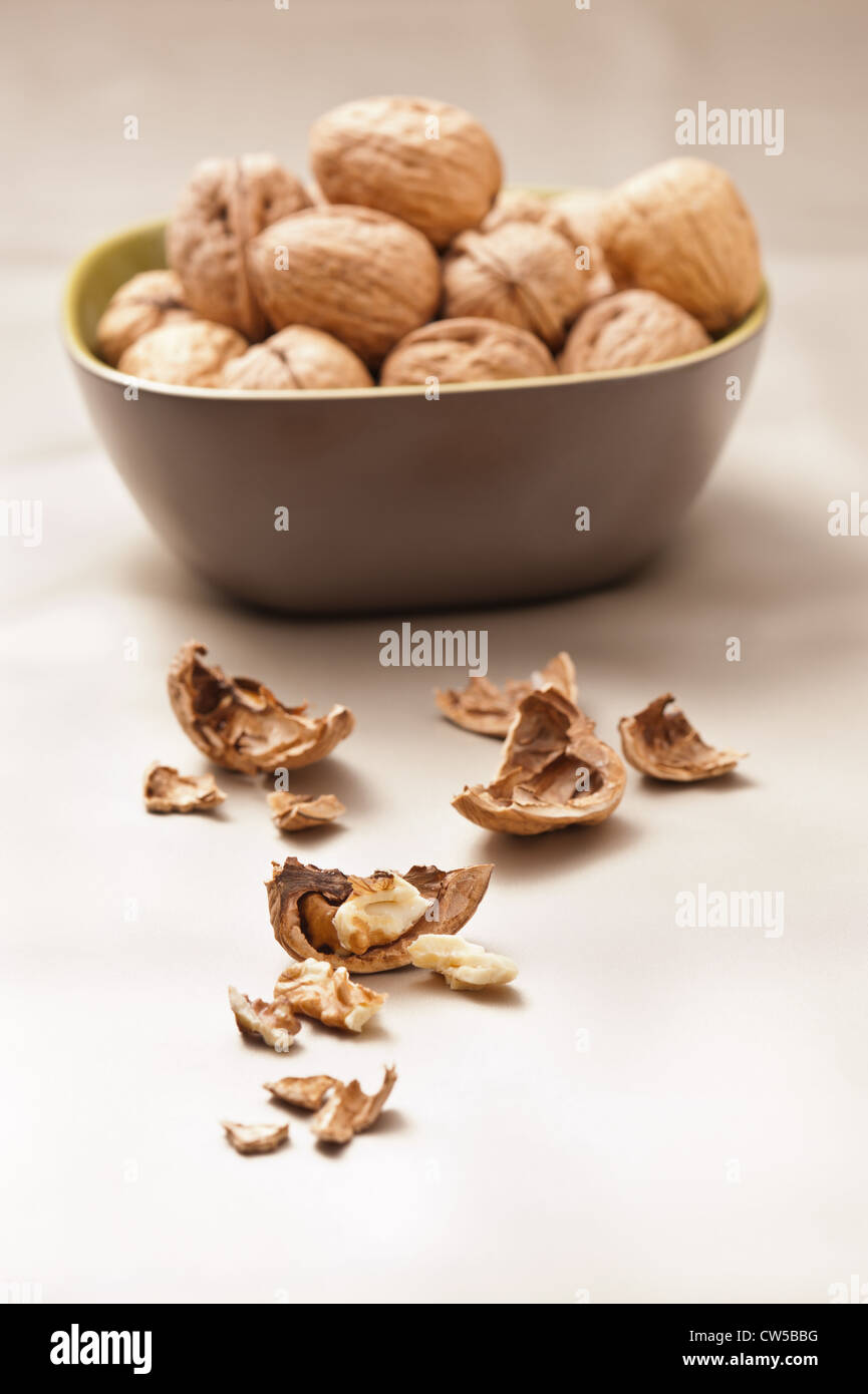 Walnut in a bowl, beige color Stock Photo - Alamy