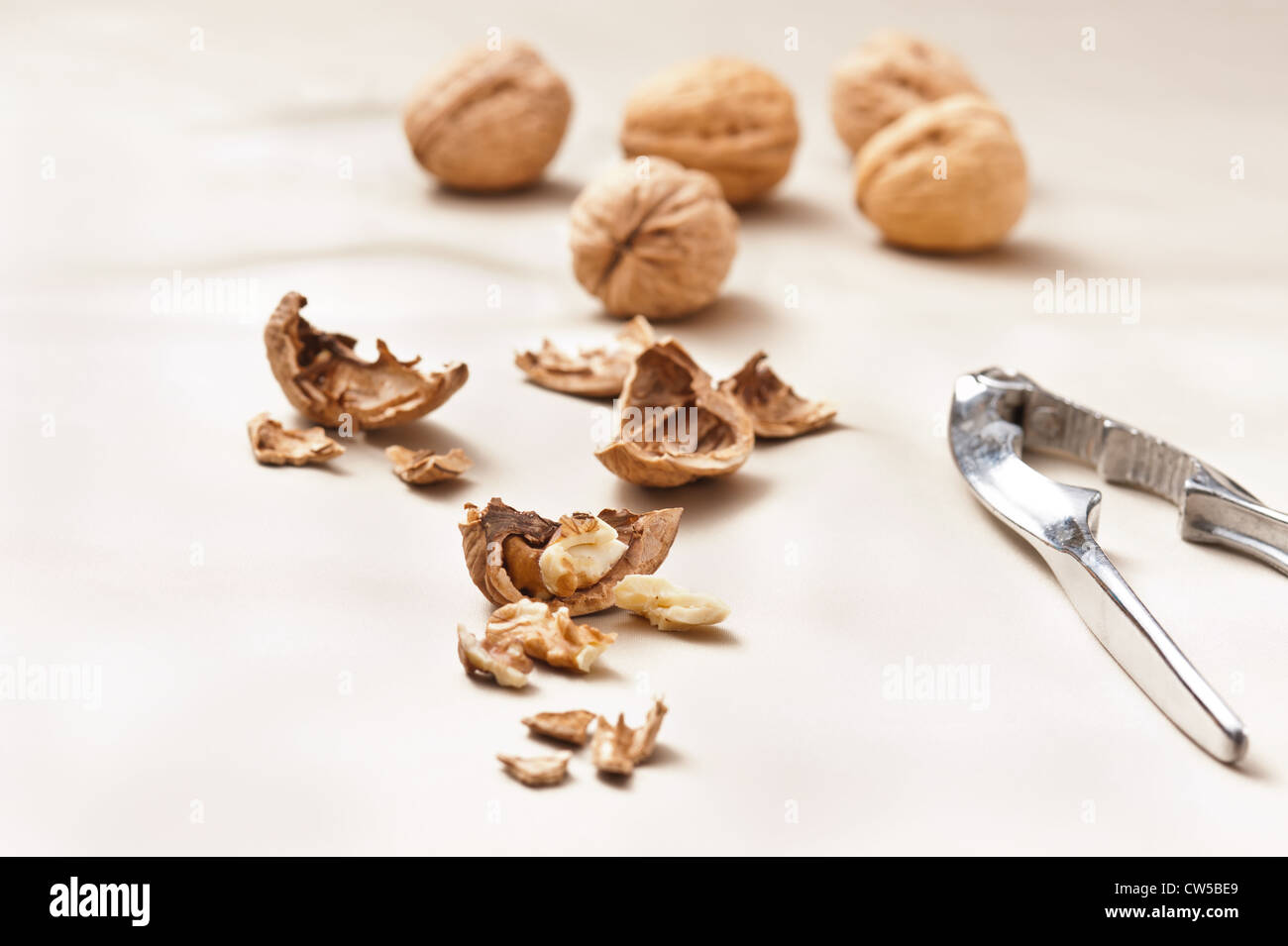 Opened and whole Walnuts , beige color Stock Photo - Alamy