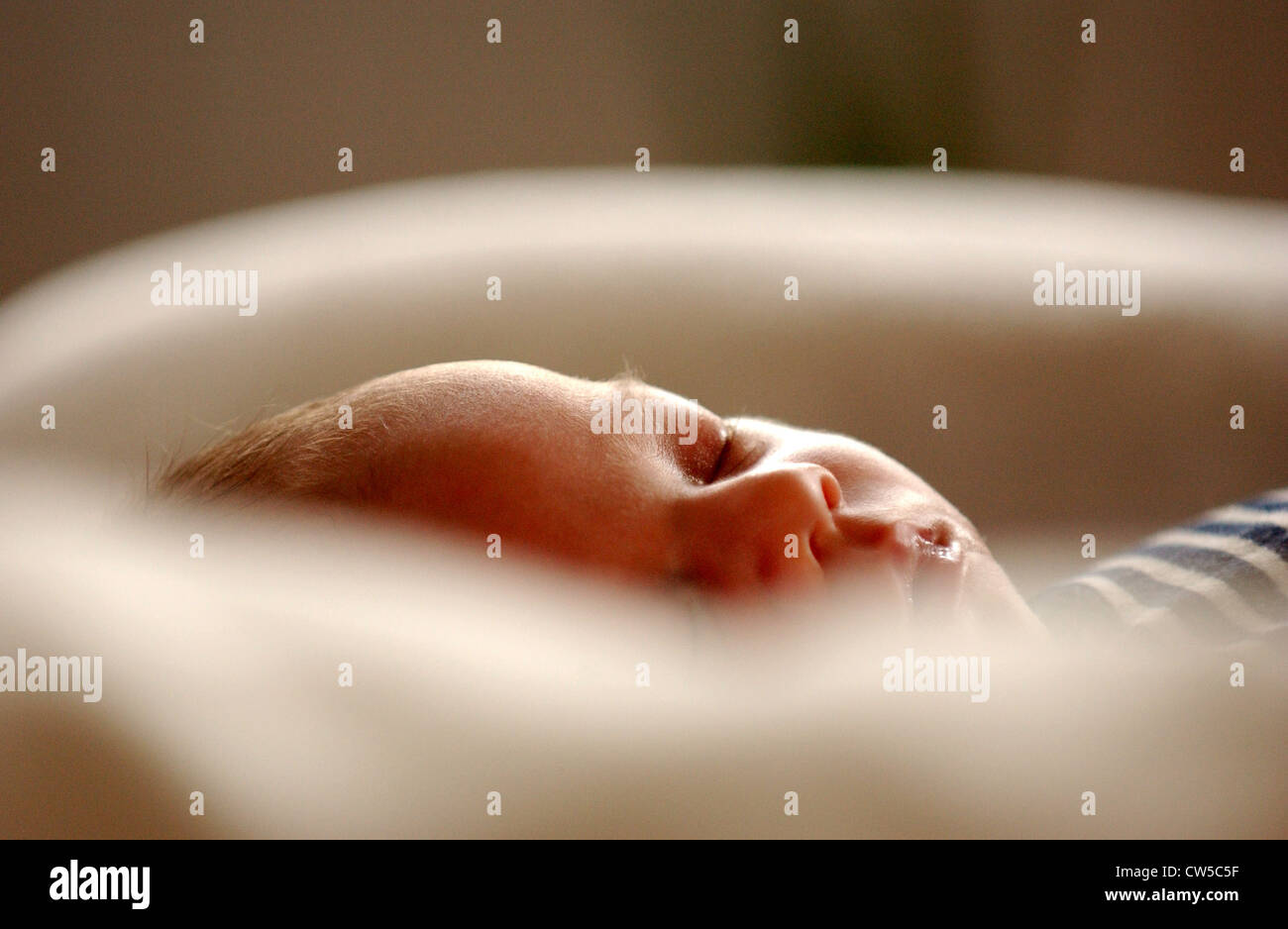 Infant sleeping in cot hi-res stock photography and images - Alamy
