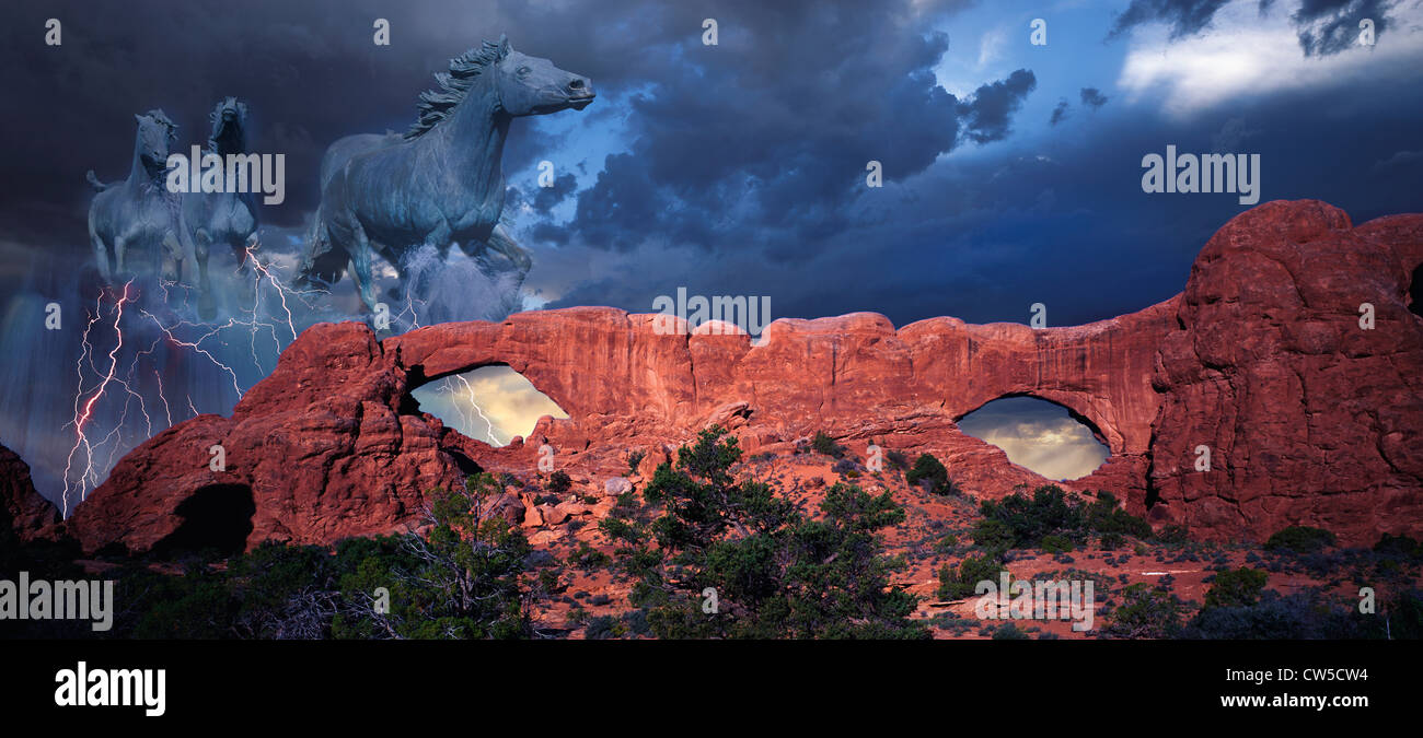 Composite image of a dark western desert with spectral ghost horses in the stormy sky Stock Photo
