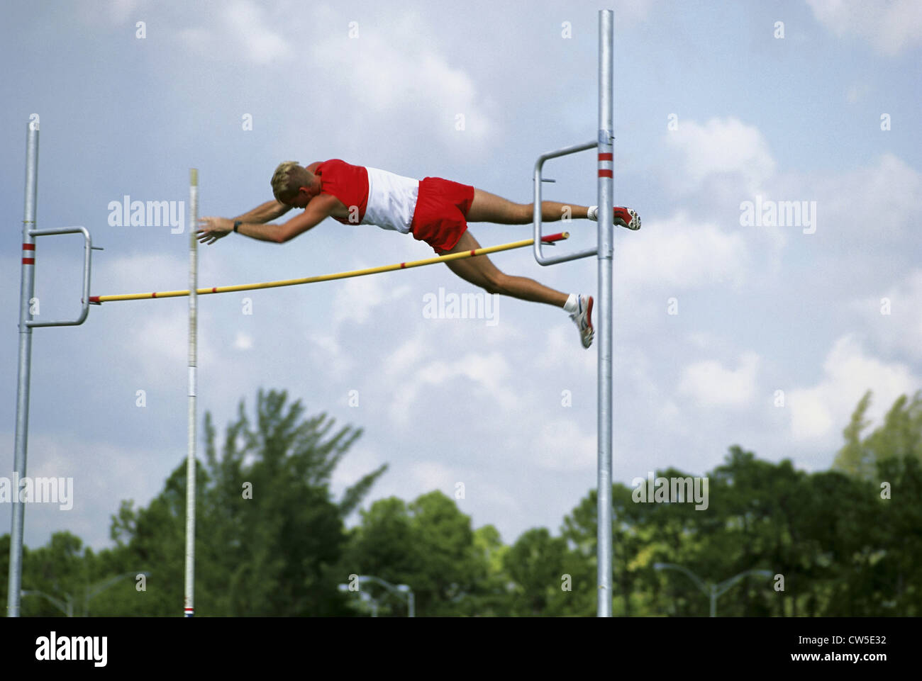 Low angle view of an athlete pole vaulting Stock Photo