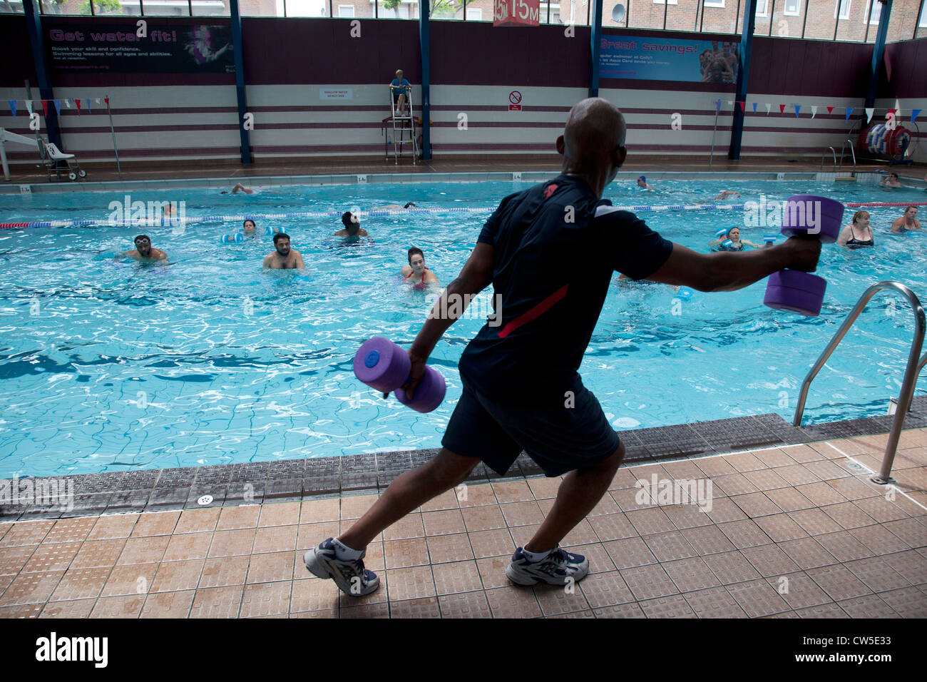 Exercise class at Cally Pool swimming pool, London. People join the class for reasons including weight loss and general fitness. Stock Photo