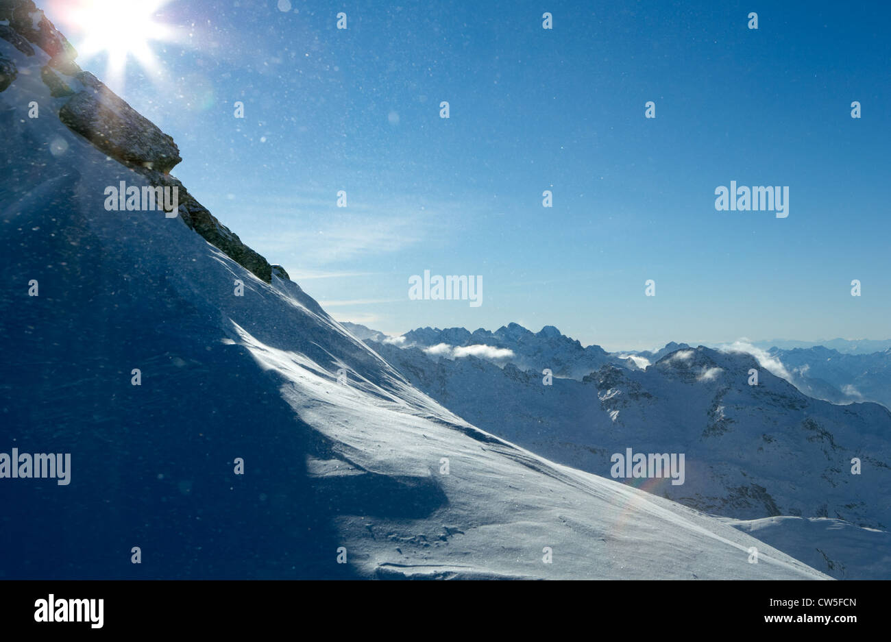 Snowdrift and snowflakes in the backlight Stock Photo