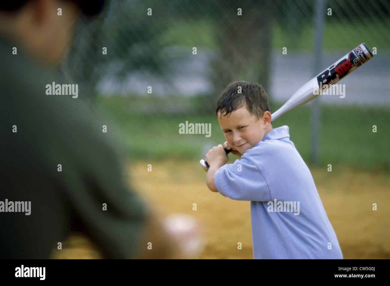 Boy playing baseball Stock Photo