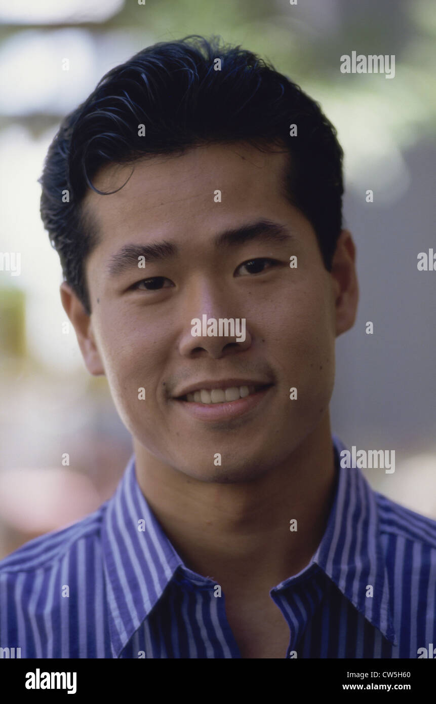 Portrait of a young man smiling Stock Photo - Alamy
