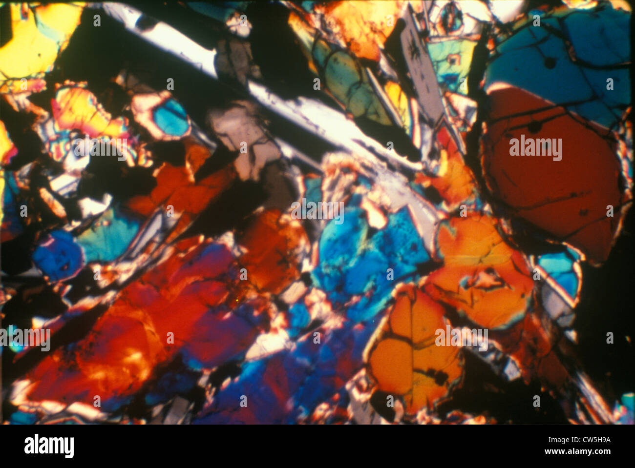 Multicolored glowing crystalline mineral rock formations Stock Photo ...