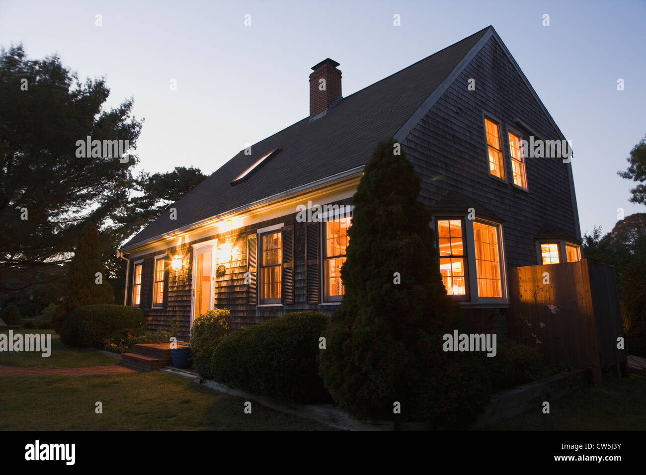 House lit up at dusk, Cape Cod, Massachusetts, USA Stock Photo - Alamy
