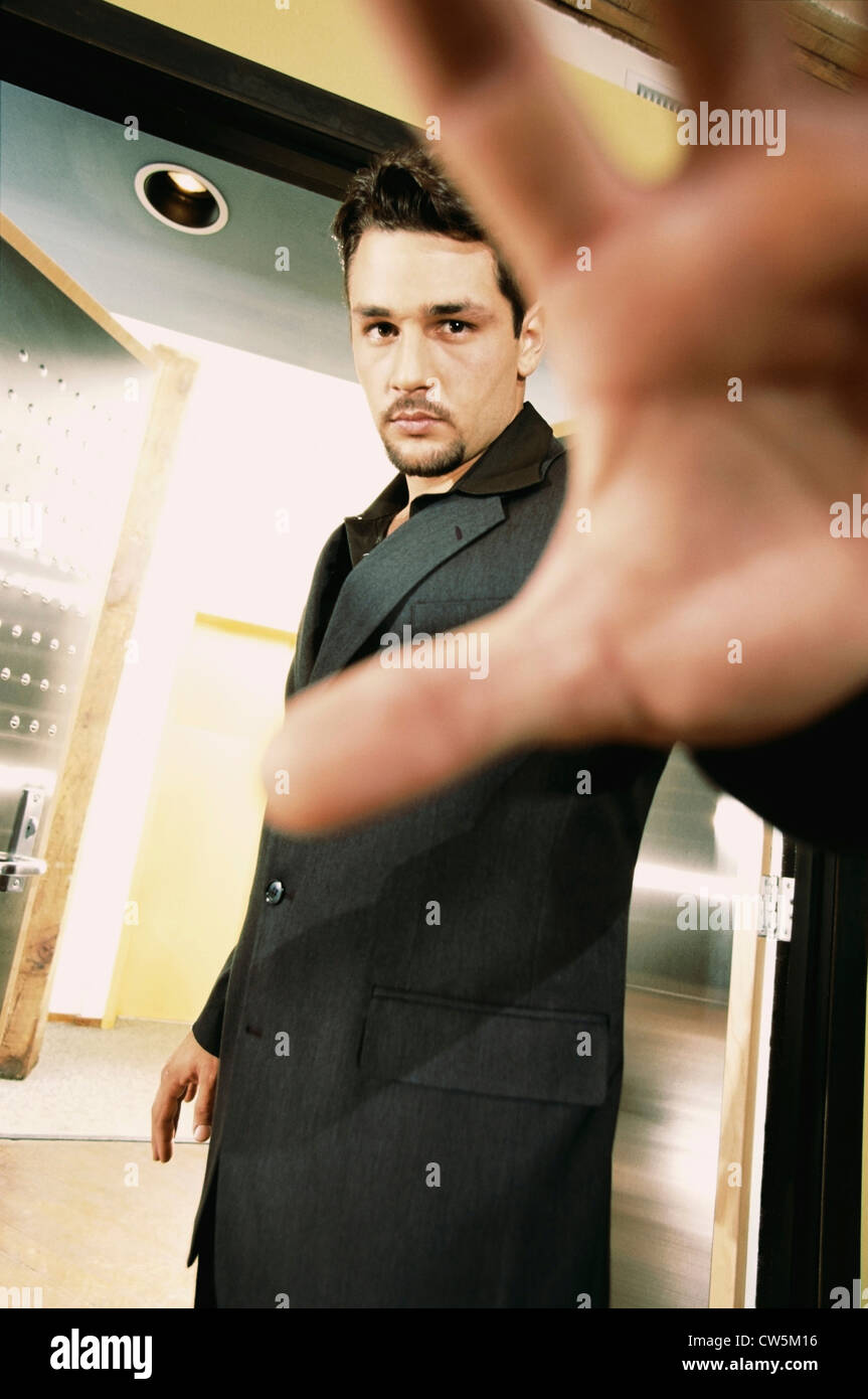 Man shielding a camera from taking a picture of him Stock Photo - Alamy