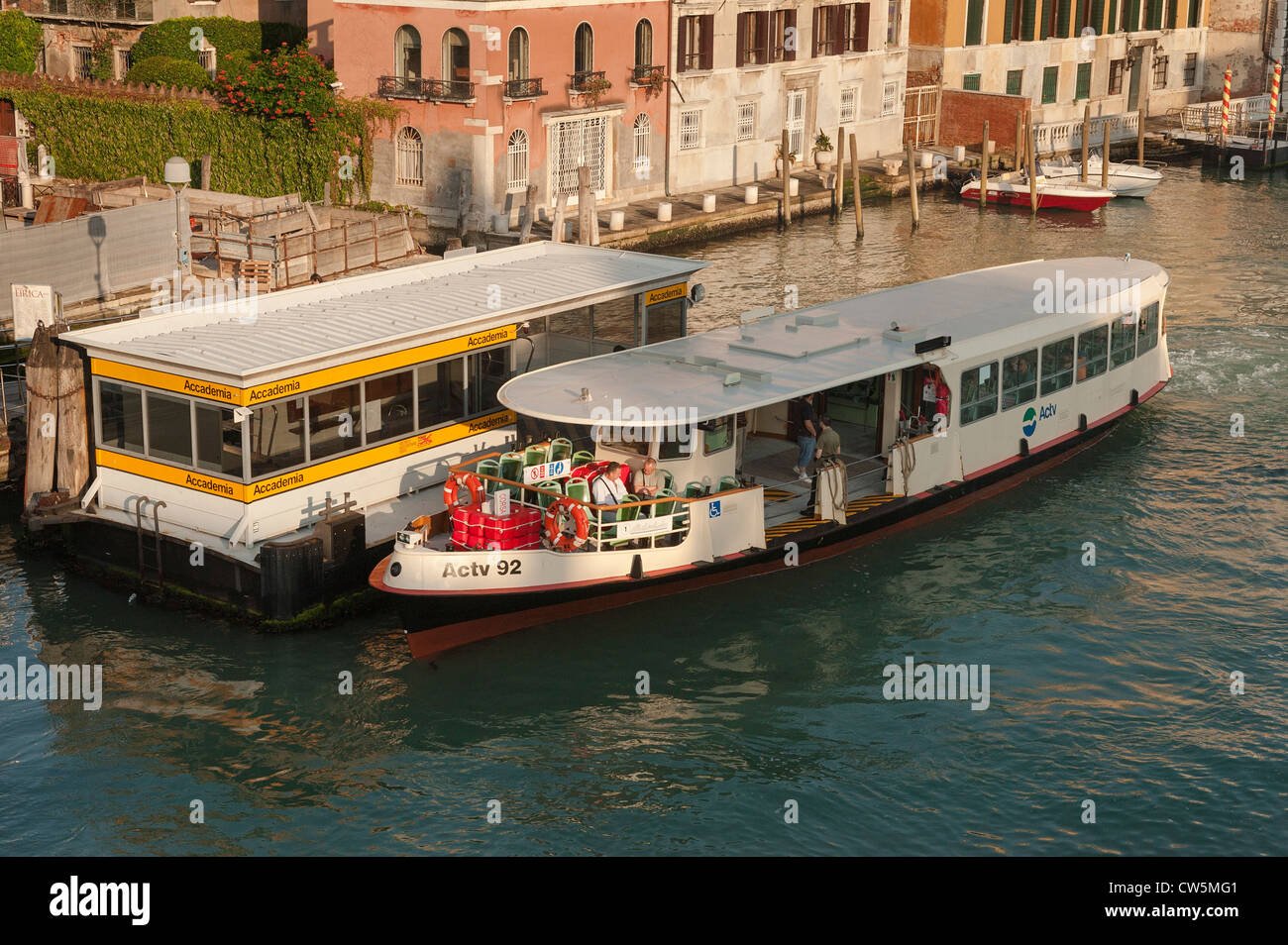 A Valporetto waterbus at the Accademia stop on the Grand Canal Venice Stock Photo