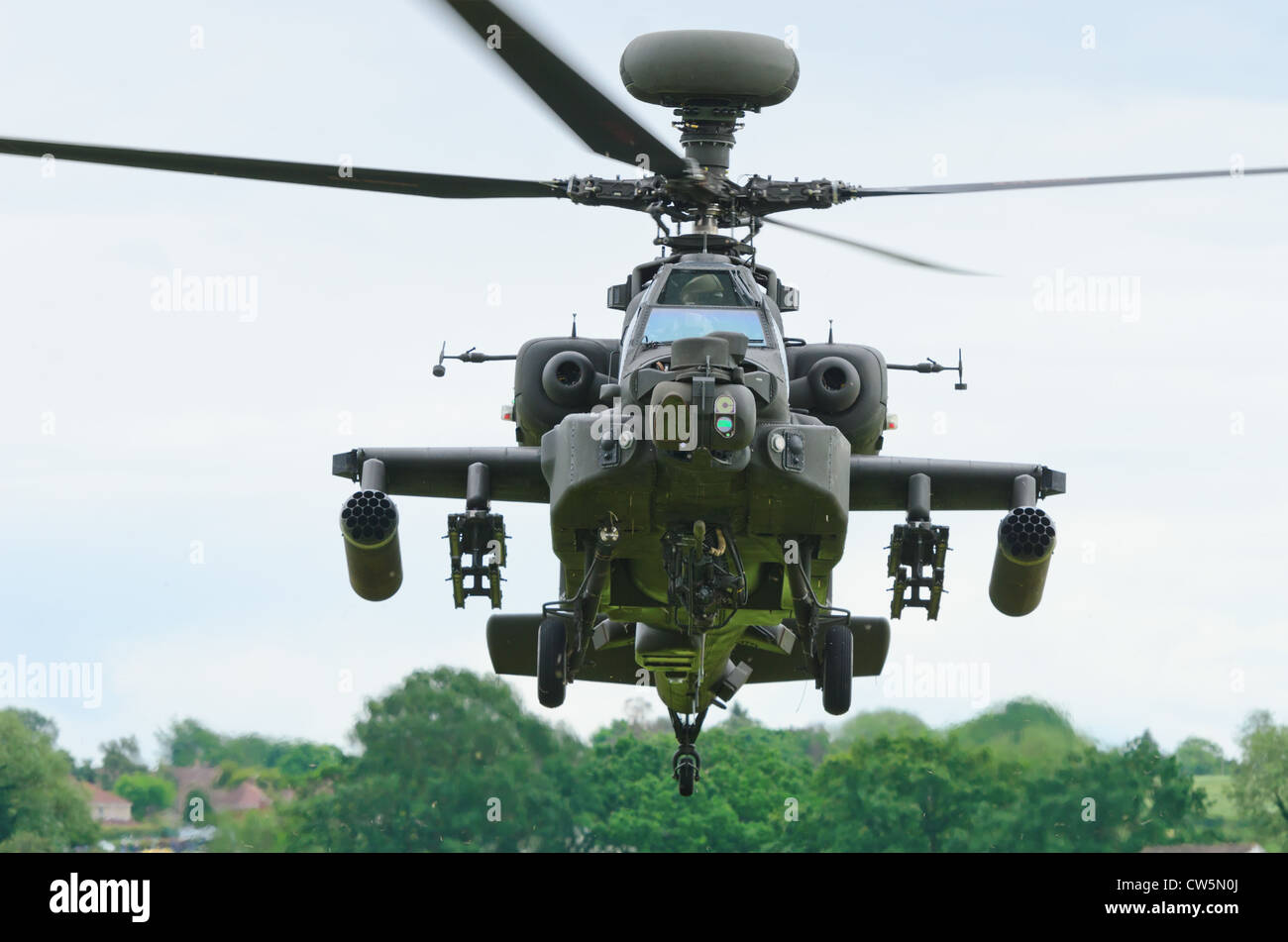 COSFORD, SHROPSHIRE, ENGLAND - JUNE 17: Boeing AH-64 Apache attack helicopter taking off for display. Stock Photo
