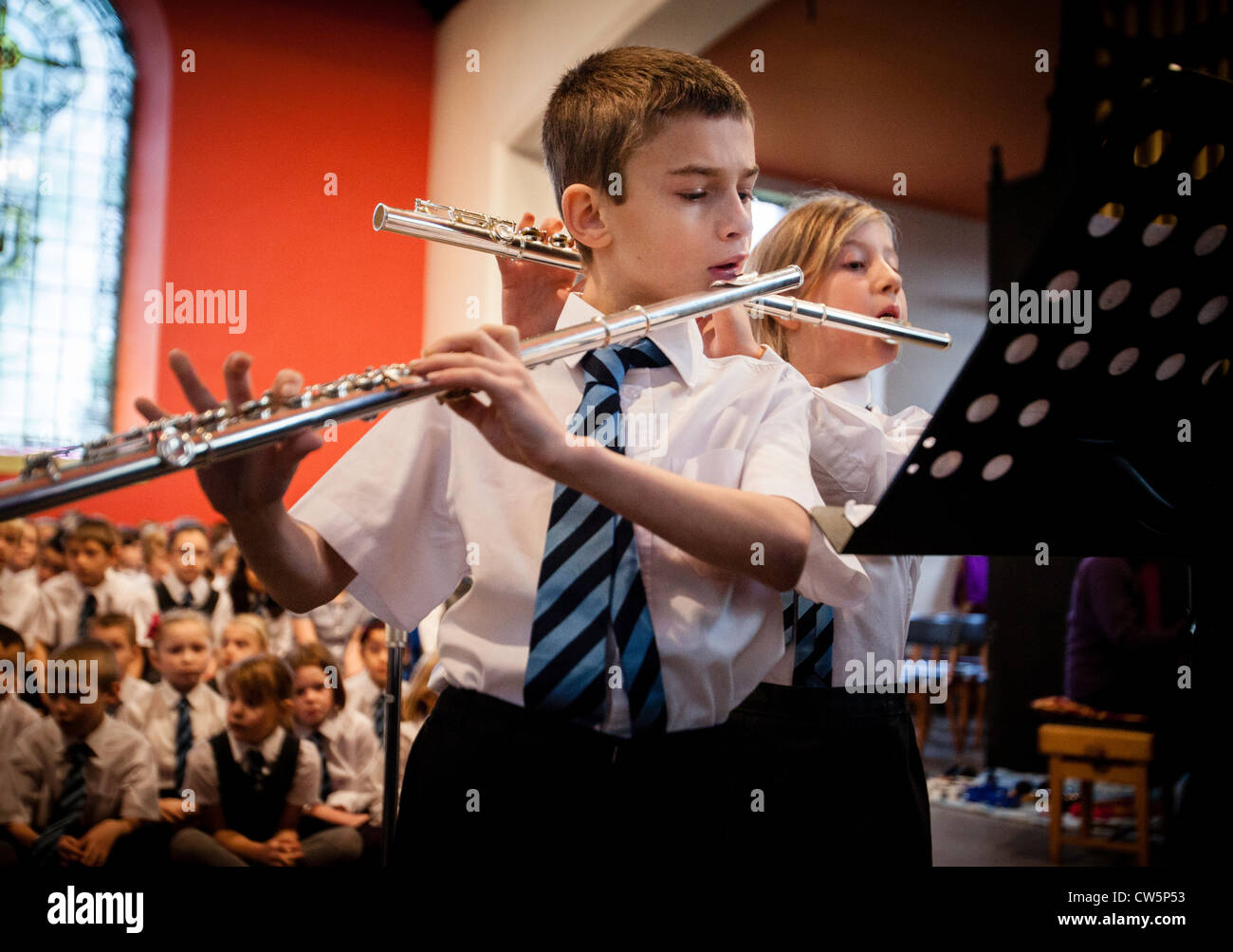 Pupils at Oakridge Primary School in Staffordshire, UK, playing in a concert at their local church. Stock Photo