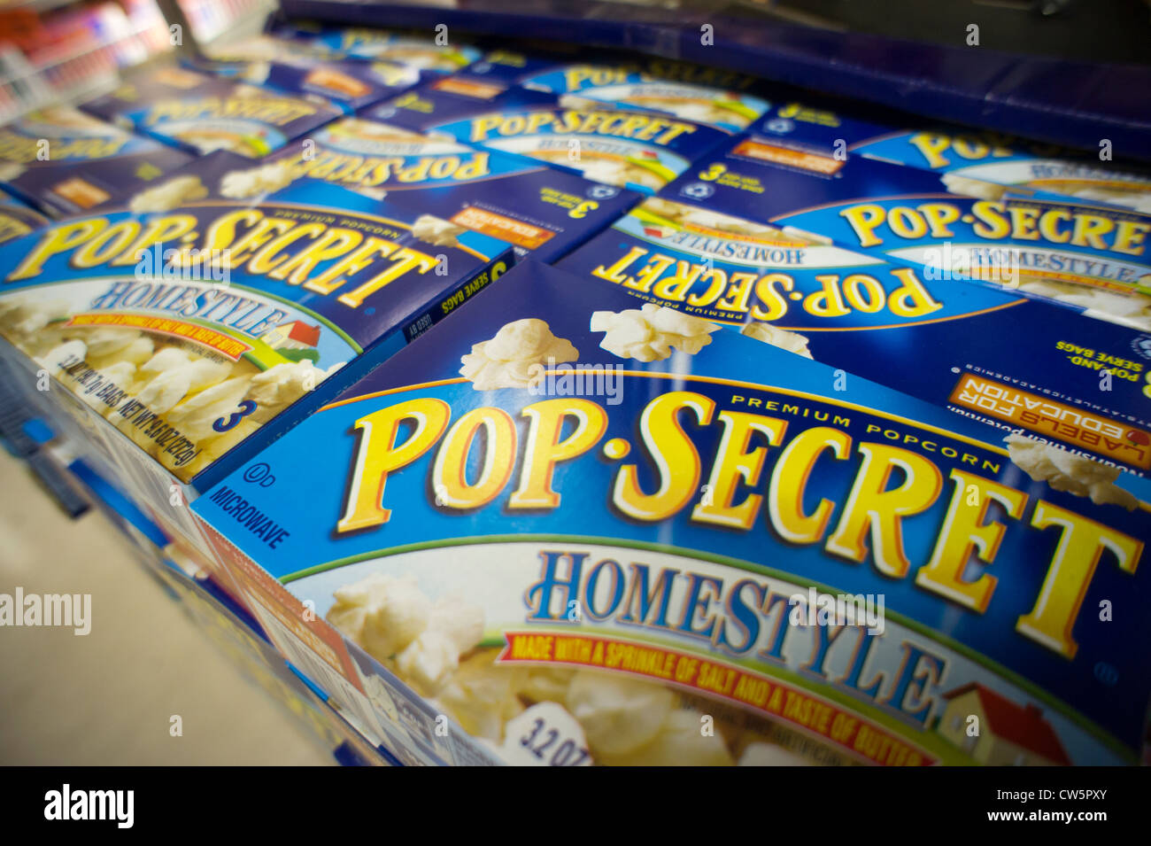 Packages of microwave popcorn are seen on a supermarket shelf in New