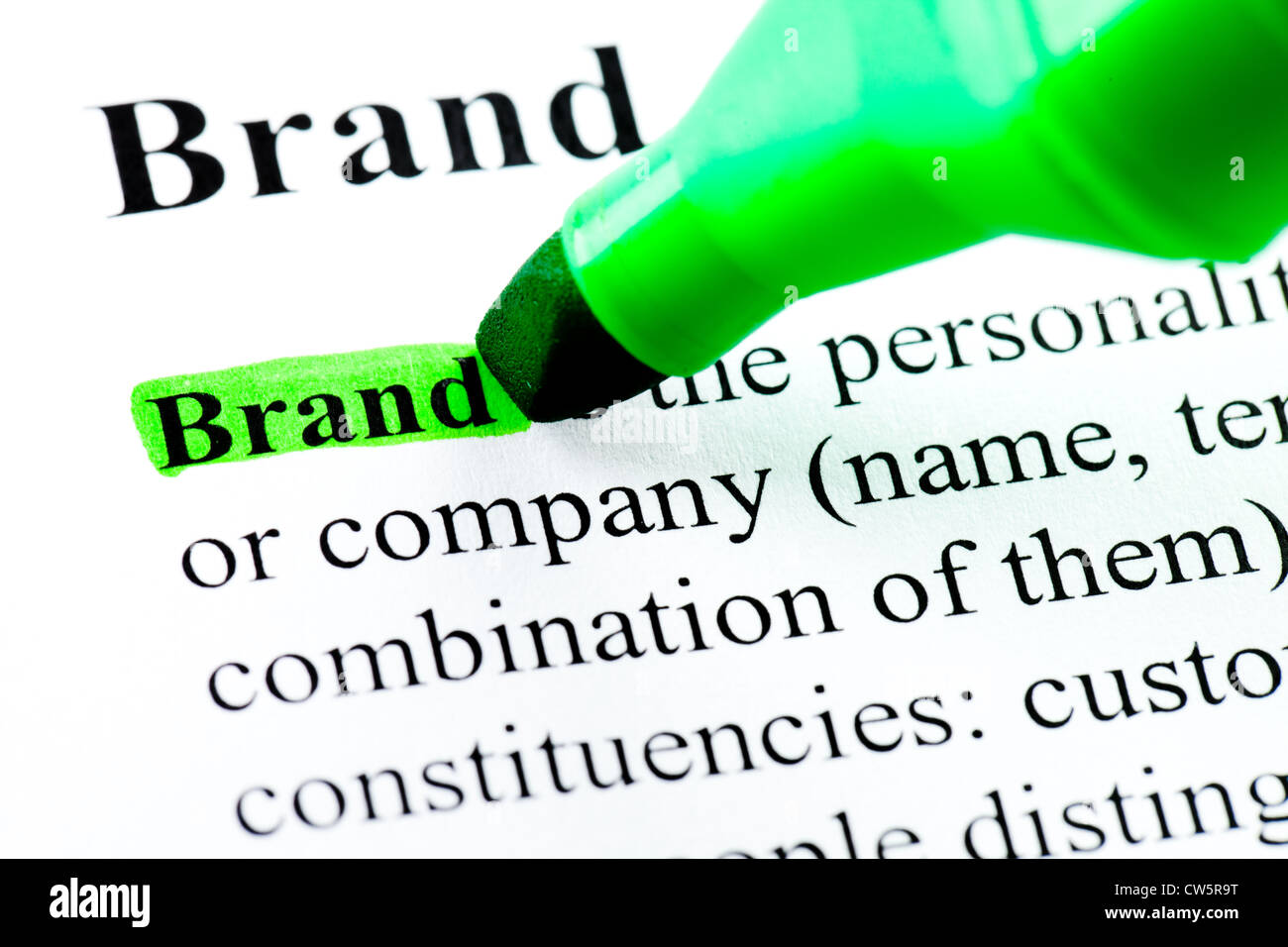 Brand word definition highlighted by green marker Stock Photo Alamy