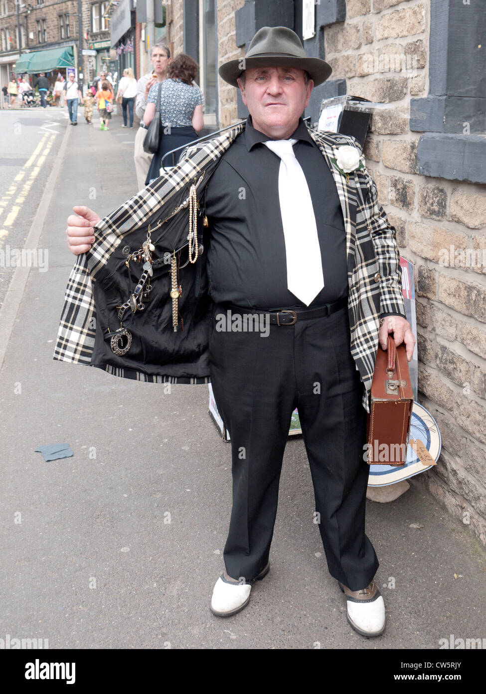 Spiv showing his goods,1940s re-enactment, Uppermill, Saddleworth, Greater Manchester, UK. Stock Photo